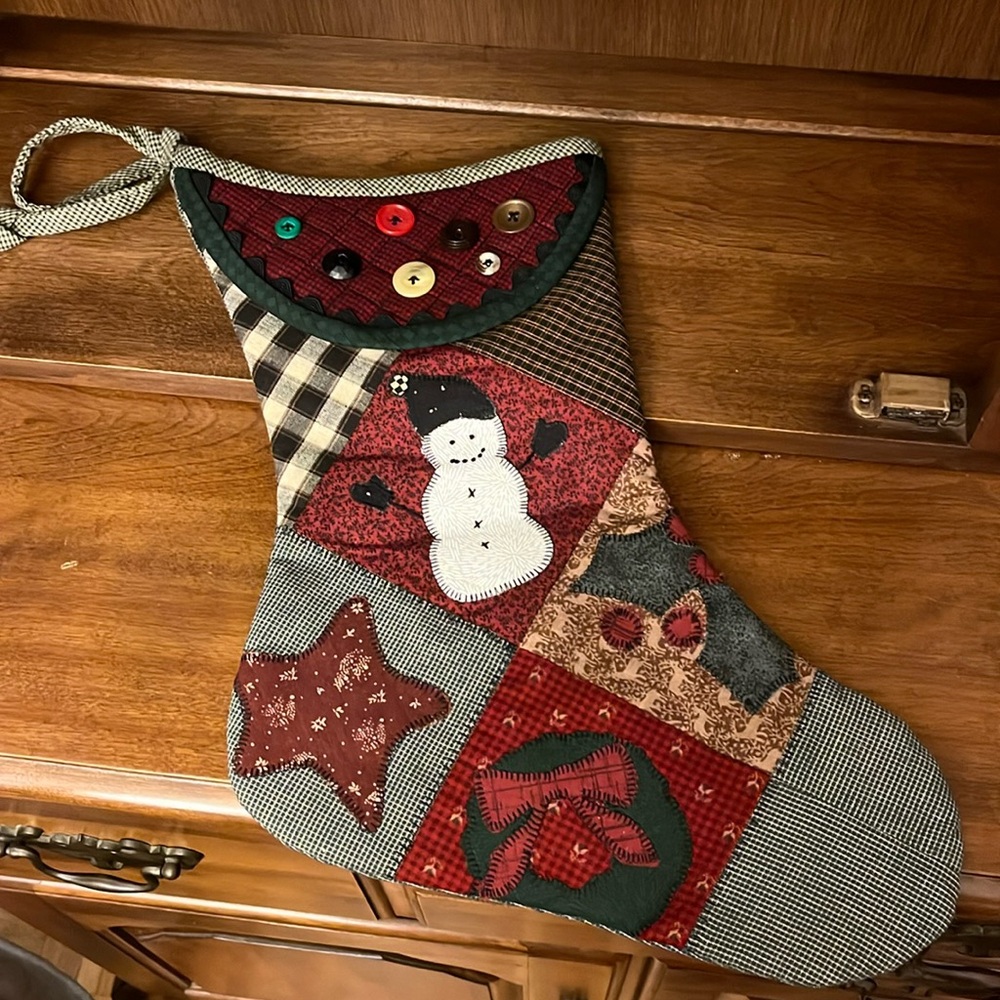 Vintage stocking with snowman and buttons